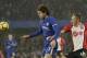 Chelsea's Marcos Alonso, left, competes for the ball with Southampton's James Ward-Prowse during the English Premier League soccer match between Chelsea and Southampton at Stamford Bridge in London, Saturday Dec. 16, 2017. (AP Photo/Tim Ireland)
