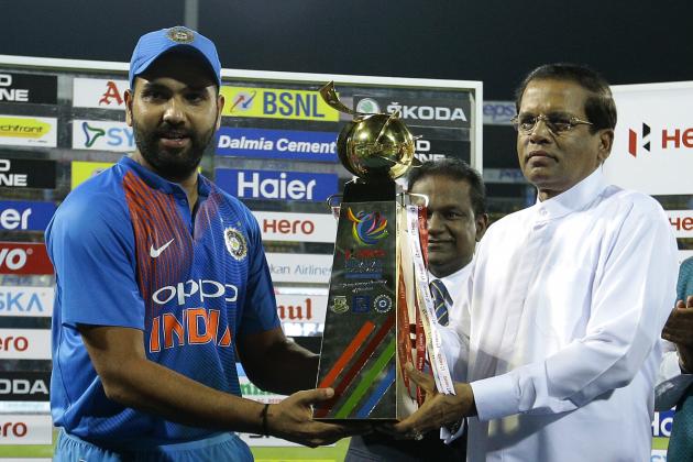 India's captain Virat Kohli receives the Nidahas triangular Twenty20 cricket series champion's trophy from Sri Lankan President Maithripala Sirisena in Colombo, Sri Lanka, Sunday, March 18, 2018, after his team won against Bangladesh.  (AP Photo/Eranga Jayawardena)