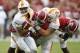 Alabama defensive lineman Joshua Frazier, center, tackles Tennessee quarterback Jarrett Guarantano, left, during the first half an NCAA college football game, Saturday, Oct. 21, 2017, in Tuscaloosa, Ala. (AP Photo/Brynn Anderson)