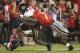 Missouri running back Damarea Crockett (16) is brought down by Georgia linebacker Lorenzo Carter (7) during the first half of an NCAA college football game Saturday, Oct. 14, 2017, in Athens, Ga. (AP Photo/John Bazemore)