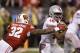 Ohio State quarterback J.T. Barrett runs past Wisconsin linebacker Leon Jacobs during the first half the Big Ten championship NCAA college football game, Saturday, Dec. 2, 2017, in Indianapolis. (AP Photo/AJ Mast)