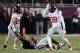 Mississippi defensive end Marquis Haynes (38) signs the land shark