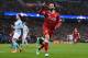MANCHESTER, ENGLAND - APRIL 10: Mohamed Salah of Liverpool celebrates scoring the first goal during the Quarter Final Second Leg match between Manchester City and Liverpool at Etihad Stadium on April 10, 2018 in Manchester, England. (Photo by Laurence Griffiths/Getty Images,)