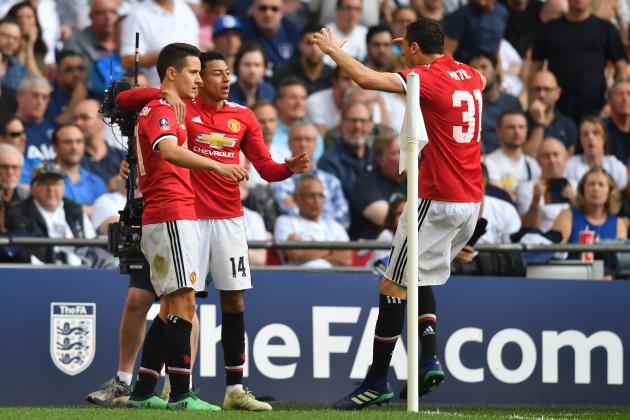 Manchester United's Spanish midfielder Ander Herrera (L) celebrates with Manchester United's English midfielder Jesse Lingard (C) and Manchester United's Serbian midfielder Nemanja Matic after scoring the team's second goal  during the English FA Cup semi-final football match between Tottenham Hotspur and Manchester United at Wembley Stadium in London, on April 21, 2018. (Photo by Ben STANSALL / AFP) / NOT FOR MARKETING OR ADVERTISING USE / RESTRICTED TO EDITORIAL USE        (Photo credit should read BEN STANSALL/AFP/Getty Images)