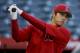 Los Angeles Angels designated hitter Shohei Ohtani, of Japan, warms up during batting practice before a baseball game against the Boston Red Sox in Anaheim, Calif., Thursday, April 19, 2018. (AP Photo/Chris Carlson)