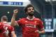 Liverpool's Egyptian midfielder Mohamed Salah celebrates scoring their second goal during the English Premier League football match between West Bromwich Albion and Liverpool at The Hawthorns stadium in West Bromwich, central England, on April 21, 2018. (Photo by Lindsey PARNABY / AFP) / RESTRICTED TO EDITORIAL USE. No use with unauthorized audio, video, data, fixture lists, club/league logos or 'live' services. Online in-match use limited to 75 images, no video emulation. No use in betting, games or single club/league/player publications. / (Photo credit should read LINDSEY PARNABY/AFP/Getty Images)