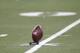 A football sits on a tee for kickoff for the Detroit Lions-St. Louis Rams NFL football game in Detroit, Sunday, Oct. 10, 2010. (AP Photo/Paul Sancya)