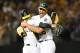 OAKLAND, CA - APRIL 21: Sean Manaea #55 and Jonathan Lucroy #21 of the Oakland Athletics celebrates after Manaea pitched a no-hitter against the Boston Red Sox at the Oakland Alameda Coliseum on April 21, 2018 in Oakland, California. The Athletics won the game 3-0. (Photo by Thearon W. Henderson/Getty Images)