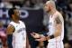 Washington Wizards guard John Wall (2) smiles next to Marcin Gortat (13) during the second half of Game 3 of an NBA basketball first-round playoff series against the Toronto Raptors, Friday, April 20, 2018, in Washington. The Wizards won 122-103. (AP Photo/Nick Wass)