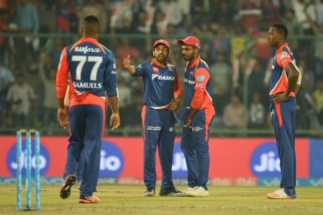 Delhi Daredevils team captain Karun Nair (2ndL) looks at a giant screen for a run out decision against  Gujarat Lions batsman and team captain Suresh Raina  during the 2017 Indian Premier League (IPL) Twenty20 cricket match between Delhi Daredevils and Gujarat Lions at the Feroz Shah Kotla Cricket Stadium in New Delhi on May 4,2017.  / AFP PHOTO / SAJJAD HUSSAIN        (Photo credit should read SAJJAD HUSSAIN/AFP/Getty Images)