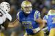 UCLA offensive lineman Scott Quessenberry looks to block against Texas A&M defensive lineman Zaycoven Henderson during an NCAA college football game, Sunday, Sept. 3, 2017, in Pasadena, Calif. UCLA won 45-44. (AP Photo/Danny Moloshok)