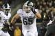 Michigan State running back L.J. Scott (3) runs with blocking from teammate guard Brian Allen (65) against Minnesota in the third quarter of an NCAA college football game Saturday, Oct. 14, 2017, in Minneapolis. Michigan State defeated Minnesota 30-27. (AP Photo/Andy Clayton-King)