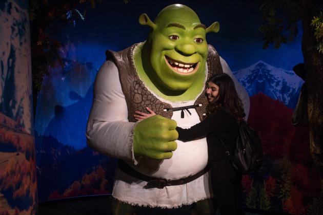 ISTANBUL, TURKEY - NOVEMBER 30:  A woman poses for a photograph as she hugs a waxwork figure of animated movie character Shrek on display at Turkey's first Madame Tussauds Wax Museum on November 30, 2016 in Istanbul, Turkey.  Madame Tussauds, Istanbul opened to the public on November 28, 2016 and showcases 55 waxwork models including a number of Turkey's famous cultural figures, celebrities and sports stars.  (Photo by Chris McGrath/Getty Images)
