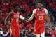 NEW ORLEANS, LA - APRIL 21: Anthony Davis #23 of the New Orleans Pelicans congratulates Jrue Holiday #11 during Game Four of the first round of the Western Conference playoffs against the Portland Trail Blazers at the Smoothie King Center on April 21, 2018 in New Orleans, Louisiana. The Pelicans defeated the Trail Blazers 131-123 to sweep the series 4-0. NOTE TO USER: User expressly acknowledges and agrees that, by downloading and or using this photograph, User is consenting to the terms and conditions of the Getty Images License Agreement. (Photo by Stacy Revere/Getty Images)