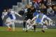 Real Madrid's Karim Benzema, center, vies for the ball with Leganes' Unai Bustinza, right, during a Spanish La Liga soccer match between Real Madrid and Leganes at the Butarque stadium in Leganes, outside Madrid, Wednesday, Feb. 21, 2018. (AP Photo/Francisco Seco)
