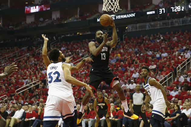 HOUSTON, TX - APRIL 25:  James Harden #13 of the Houston Rockets passes under the basket defended by Karl-Anthony Towns #32 of the Minnesota Timberwolves in the first half during Game Five of the first round of the 2018 NBA Playoffs at Toyota Center on April 25, 2018 in Houston, Texas.  NOTE TO USER: User expressly acknowledges and agrees that, by downloading and or using this photograph, User is consenting to the terms and conditions of the Getty Images License Agreement.  (Photo by Tim Warner/Getty Images)