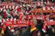 Liverpool fans sing and hold up scarves prior to the Champions League semifinal, first leg, soccer match between Liverpool and Roma at Anfield Stadium, Liverpool, England, Tuesday, April 24, 2018. (AP Photo/Rui Vieira)