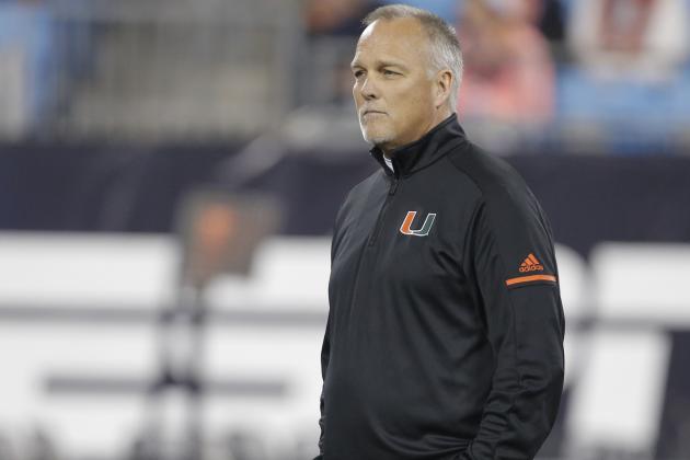Miami head coach Mark Richt watches his team warm up before the Atlantic Coast Conference championship against the Clemson NCAA college football game in Charlotte, N.C., Saturday, Dec. 2, 2017. (AP Photo/Bob Leverone)