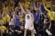 Golden State Warriors' Klay Thompson, center, celebrates after making a 3-point basket next to New Orleans Pelicans' Ian Clark, right, during the first half in Game 1 of an NBA basketball second-round playoff series Saturday, April 28, 2018, in Oakland, Calif. (AP Photo/Marcio Jose Sanchez)