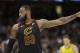 Cleveland Cavaliers' LeBron James talks with a teammate in the second half of Game 7 of an NBA basketball first-round playoff series against the Indiana Pacers, Sunday, April 29, 2018, in Cleveland. (AP Photo/Tony Dejak)