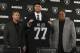 Oakland Raiders draft pick Kolton Miller stands between coach Jon Gruden, left, and General Manager Reggie McKenzie after an NFL football media conference Friday, April 26, 2018, in Alameda, Calif. (AP Photo/Ben Margot)