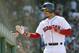 Boston Red Sox's Mookie Betts celebrates at the dugout after hitting his third home run of the game in the seventh inning of a baseball game against the Kansas City Royals at Fenway Park, Wednesday, May 2, 2018, in Boston. (AP Photo/Elise Amendola)