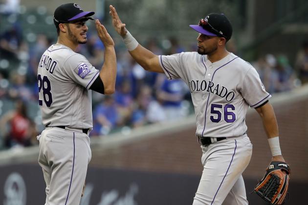 Colorado Rockies' Nolan Arenado, left, celebrates with Noel Cuevas after the Rockies defeated the Chicago Cubs 11-2 in a baseball game Wednesday, May 2, 2018, in Chicago. (AP Photo/Nam Y. Huh)