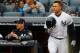 NEW YORK, NY - APRIL 04: Giancarlo Stanton #27 and manager Aaron Boone #17 of the New York Yankees look on against the Tampa Bay Rays at Yankee Stadium on April 4, 2018 in the Bronx borough of New York City. The Yankees defeated the Rays 7-2. (Photo by Jim McIsaac/Getty Images)
