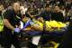 Golden State Warriors guard Patrick McCaw is taken off the court on a stretcher after falling hard to the floor late in the third quarter following a Flagrant 1 foul by Sacramento Kings's Vince Carter in an NBA basketball game Saturday, March 31, 2018, in Sacramento, Calif. The Warriors won 112-96. (AP Photo/Rich Pedroncelli)