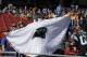 A Carolina Panthers fan displays a cape with the team's logo before the NFL Super Bowl 50 football game between the Denver Broncos and the Carolina Panthers, Sunday, Feb. 7, 2016, in Santa Clara, Calif. (AP Photo/Ben Margot)