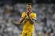 Juventus' Mario Mandzukic greets supporters at the end of a Champions League quarter-final, 2nd leg soccer match between Real Madrid and Juventus at the Santiago Bernabeu stadium in Madrid, Spain, Wednesday, April 11, 2018. (AP Photo/Paul White)