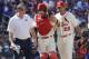 St. Louis Cardinals trainer Chris Conroy, left, and manager Mike Matheny (22) take catcher Yadier Molina back to the dugout after Molina was injured on a pitch during the ninth inning of a baseball game against the Chicago Cubs, Saturday, May 5, 2018, in St. Louis. (AP Photo/Charles Rex Arbogast)