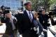 FILE - In this April 12, 2018, file photo, San Francisco 49ers linebacker Reuben Foster, center, exits the Santa Clara County Superior Court after his arraignment in San Jose, Calif. Prosecutors say the ex-girlfriend of Foster has submitted a video to support her statement that she lied when she told authorities Foster had hit her. But Santa Clara County prosecutor Jim Dermertzis said Monday, April 30, 2018, the district attorney's office will continue to prosecute the domestic violence case against Foster even if his ex-girlfriend, Elissa Ennis, does not cooperate with the investigation. (AP Photo/Marcio Jose Sanchez, File)