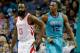 CHARLOTTE, NC - OCTOBER 27: James Harden #13 of the Houston Rockets and Dwight Howard #12 of the Charlotte Hornets watch on during their game at Spectrum Center on October 27, 2017 in Charlotte, North Carolina. NOTE TO USER: User expressly acknowledges and agrees that, by downloading and or using this photograph, User is consenting to the terms and conditions of the Getty Images License Agreement. (Photo by Streeter Lecka/Getty Images)
