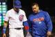 CHICAGO, IL - MAY 07: Javier Baez #9 of the Chicago Cubs is escorted from the field by trainer Nick Frangella after suffering an apparent injury in the 7th inning against the Miami Marlins at Wrigley Field on May 7, 2018 in Chicago, Illinois. (Photo by Jonathan Daniel/Getty Images)