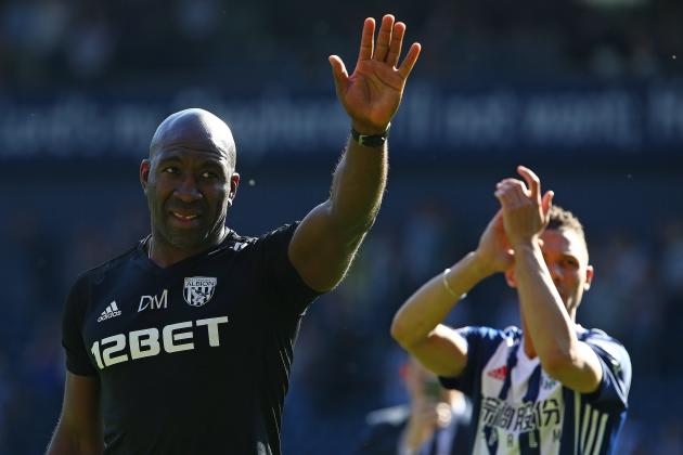 West Bromwich Albion's caretaker manager Darren Moore applauds the fans following the English Premier League football match between West Bromwich Albion and Tottenham Hotspur at The Hawthorns stadium in West Bromwich, central England, on May 5, 2018. - West Bromwhich won the match 1-0. (Photo by Geoff CADDICK / AFP) / RESTRICTED TO EDITORIAL USE. No use with unauthorized audio, video, data, fixture lists, club/league logos or 'live' services. Online in-match use limited to 75 images, no video emulation. No use in betting, games or single club/league/player publications. / (Photo credit should read GEOFF CADDICK/AFP/Getty Images)