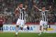 Juventus' defender from Italy Medhi Benatia (L) celebrates with teammate Juventus' forward from Argentina Paulo Dybala after scoring during the Italian Tim Cup (Coppa Italia) final Juventus vs AC Milan at the Olympic stadium on May 9, 2018 in Rome. (Photo by Tiziana FABI / AFP) (Photo credit should read TIZIANA FABI/AFP/Getty Images)