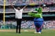PHILADELPHIA, PA - MAY 10: American Ninja Warrior co-host and former NFL player, Akbar Gbajabiamila, performs on the field between innings with the Phillie Phanatic during a game between the San Francisco Giants and the Philadelphia Phillies at Citizens Bank Park on May 10, 2018 in Philadelphia, Pennsylvania. The Phillies won 6-3. (Photo by Hunter Martin/Getty Images)
