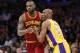 Cleveland Cavaliers' LeBron James, left, moves into position while Los Angeles Lakers' Kobe Bryant, right, defends during the first half of an NBA basketball game Thursday, March 10, 2016, in Los Angeles. (AP Photo/Danny Moloshok)