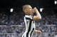 NEWCASTLE UPON TYNE, ENGLAND - MAY 13: Dwight Gayle of Newcastle United celebrates after scoring his sides first goal during the Premier League match between Newcastle United and Chelsea at St. James Park on May 13, 2018 in Newcastle upon Tyne, England. (Photo by Ian MacNicol/Getty Images)