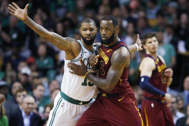 Cleveland Cavaliers forward LeBron James, right, fights for position against Boston Celtics forward Marcus Morris (13) during the third quarter of Game 1 of the NBA basketball Eastern Conference Finals, Sunday, May 13, 2018, in Boston. (AP Photo/Michael Dwyer)