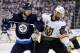 WINNIPEG, MB - MAY 12: Pierre-Edouard Bellemare #41 of the Vegas Golden Knights grabs the puck as Joel Armia #40 of the Winnipeg Jets defends in Game One of the Western Conference Finals during the 2018 NHL Stanley Cup Playoffs at Bell MTS Place on May 12, 2018 in Winnipeg, Canada. (Photo by Elsa/Getty Images)