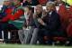 Arsenal's French manager Arsene Wenger (R), Arsenal's assistant manager Steve Bould (C) and irst-team physiotherapist Colin Lewin (L) react during the English Premier League football match between Arsenal and Leicester City at the Emirates Stadium in London on August 11, 2017. / AFP PHOTO / Ian KINGTON / RESTRICTED TO EDITORIAL USE. No use with unauthorized audio, video, data, fixture lists, club/league logos or 'live' services. Online in-match use limited to 75 images, no video emulation. No use in betting, games or single club/league/player publications. / (Photo credit should read IAN KINGTON/AFP/Getty Images)