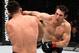 TORONTO, CANADA - DECEMBER 10: (R-L) Tim Kennedy punches Kelvin Gastelum in their middleweight bout during the UFC 206 event inside the Air Canada Centre on December 10, 2016 in Toronto, Ontario, Canada. (Photo by Jeff Bottari/Zuffa LLC/Zuffa LLC via Getty Images)