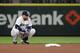Seattle Mariners second baseman Robinson Cano crouches by the base during a baseball game against the Houston Astros, Monday, April 16, 2018, in Seattle. (AP Photo/Ted S. Warren)