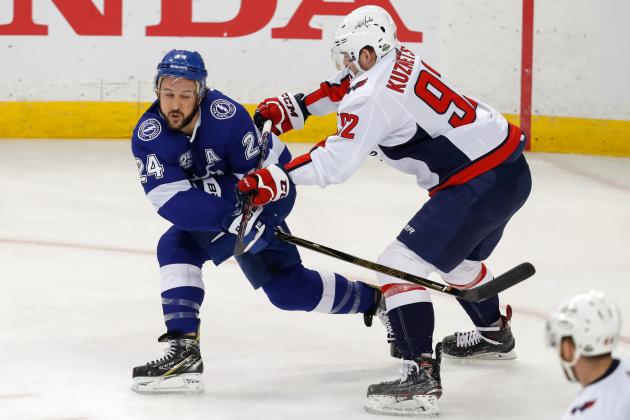 TAMPA, FL - MAY 13: Ryan Callahan #24 of the Tampa Bay Lightning shoots past the check of Evgeny Kuznetsov #92 of the Washington Capitals during the first period in Game Two of the Eastern Conference Finals during the 2018 NHL Stanley Cup Playoffs at Amalie Arena on May 13, 2018 in Tampa, Florida. (Photo by Mike Carlson/Getty Images)