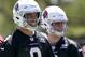 Arizona Cardinals' Sam Bradford (9) and Josh Rosen (3) watch teammates during an organized team activity Tuesday, May 15, 2018, in Tempe, Ariz. (AP Photo/Matt York)
