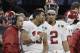 Alabama's Jalen Hurts (2) is seen on the bench with Tua Tagovailoa (13) head coach Nick Saban during the second half of the NCAA college football playoff championship game against Georgia Monday, Jan. 8, 2018, in Atlanta. (AP Photo/David J. Phillip)