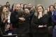 Former gymnast Rachael Denhollander, center, is hugged after giving her victim impact statement during the seventh day of Larry Nassar's sentencing hearing Wednesday, Jan. 24, 2018, in Lansing, Mich. At right is Assistant Attorney General Angela Povilaitis. Nassar has admitted sexually assaulting athletes when he was employed by Michigan State University and USA Gymnastics, which is the sport's national governing organization and trains Olympians. (AP Photo/Carlos Osorio)