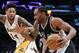 San Antonio Spurs' Kawhi Leonard, right, drives past Los Angeles Lakers' Brandon Ingram during the second half of an NBA basketball game, Sunday, Feb. 26, 2017, in Los Angeles. (AP Photo/Jae C. Hong)